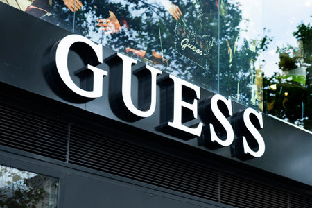 BARCELONA, SPAIN - AUGUST 9, 2018: Closeup of the signboard of the Guess store in the famous Passeig de Gracia avenue in Barcelona, Spain, one of the most important streets in the cityのeditorial素材