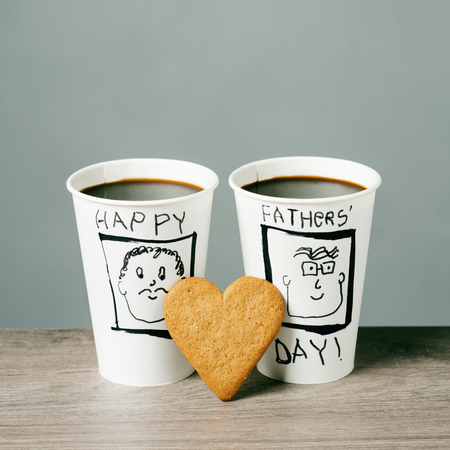 Closeup of two disposable cups with coffeeの写真素材