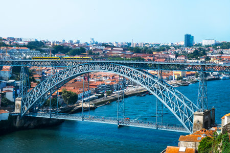 PORTO, PORTUGAL - AUGUST 29, 2018: A view of the famous Dom Luis I Bridge, over the Douro River, one of the most important landmarks in the cityのeditorial素材