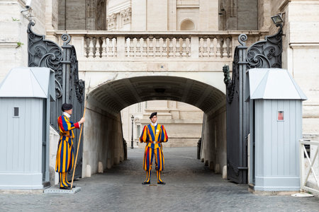 VATICAN CITY, VATICAN - OCTOBER 15, 2019: Members of the Pontifical Swiss Guard, one of them with...