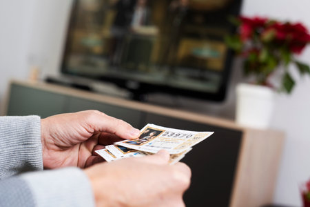 BARCELONA, SPAIN - DESEMBER 11, 2019: Closeup of a man with some tickets of the Spanish Christmas...