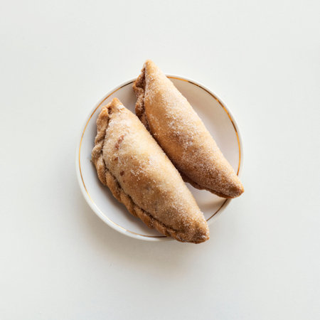 high angle view of some pastissets, typical pastries of Catalonia, Spain, filled with pumpkin, sweet...