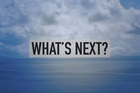 a view over a calm sea and a cloudy sky, after the storm, and the question what is next? in the foregroundの写真素材