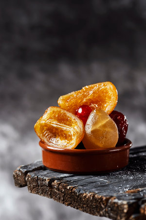 some appetizing spanish candied fruit, such as orange, pear, prune or maraschino cherries, typically...