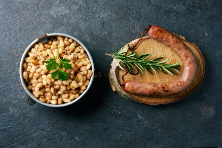 high angle view of botifarra amb mongetes, literally sausage and white beans, a dish traditional of...