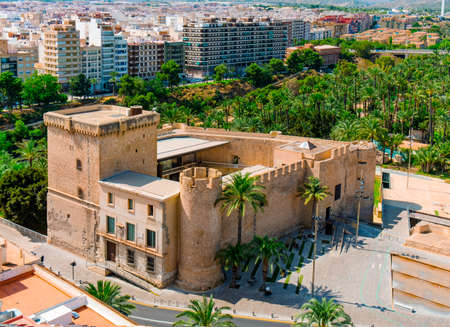 an aerial view of the Altamira Castle and the famous Palmeral de Elche, also known as Palm Grove of Elche, a public park with many palm trees in Elche, in the Valencian Community, Spainの写真素材