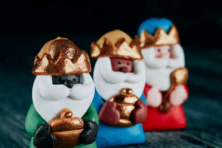 closeup of the three wise men, melchior, caspar and balthazar, on a gray rustic surfaceの写真素材