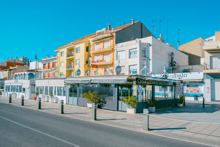 Cambrils, Spain - November 19, 2021: A view of the inner side of the seafront of Cambrils, in the famous Costa Daurada coast, Spain, with many restaurantsのeditorial素材