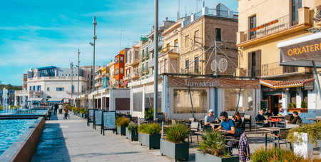 Tarragona, Spain - December 29, 2021: A view of the pedestrian area at El Serrallo, the traditional fishermen district in Tarragona, Spain, with many well-known fish restaurantsのeditorial素材
