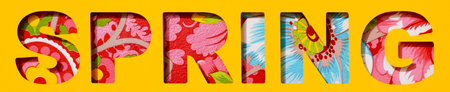 the word spring, cut out on a yellow paper, and a floral background seen through the cutout letters, in a panoramic format to use as web banner or headerの写真素材