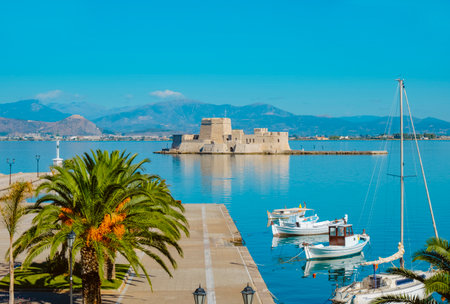 a view of the port of Napflio and Bourtzi castle in the Aegean sea, in Greeceの写真素材