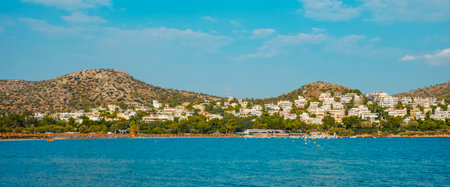 a panoramic view of the Vouliagmeni beach, in Vouliagmeni, Greece, on a summer dayの写真素材