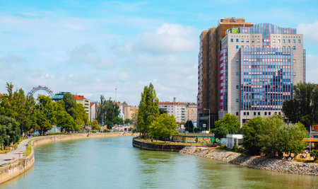 Vienna, Austria - August 28, 2022: The Danube canal in Vienna, Austria, border between Leopoldstadt district on the left, highlighting the Prater Ferris Wheel, and Landstrasse district on the rightのeditorial素材