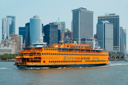 New York City, United States - May 22, 2023: A ferryboat of the Staten Island Ferry is departing from Whitehall Terminal in Manhattan, on a sunny spring dayのeditorial素材