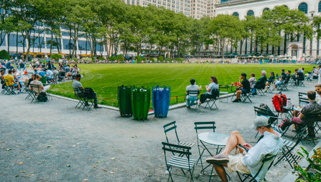 New York City, United States - May 16, 2023: People relaxing at popular Bryant Park, in Midtown Manhattan, New York City, United States, on a sunny spring dayのeditorial素材