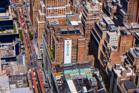 New York City, USA - May 16, 2023: Aerial view of West 34th Street in Midtown Manhattan, New York City, as seen from the Empire States Building, highlighting the sign of famous Macys department storeのeditorial素材