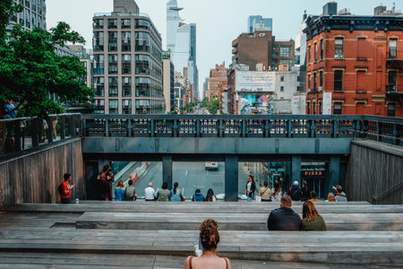 New York City, US - May 22, 2023: People at the High Line Observation Deck, above the 10th Avenue, in New York City, United States, in the evening of a spring dayのeditorial素材