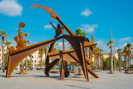 Barcelona, Spain - July 27, 2023: A view of Placa del Mar square in La Barceloneta, Barcelona, Spain, highlighting the Homenatge a la Natacio sculpture, tribute to swimming as sport, in the foregroundのeditorial素材