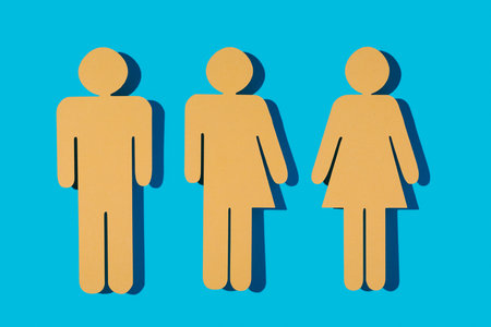 three yellow gender icons on a blue background, a male gender icon, a gender neutral icon and a...