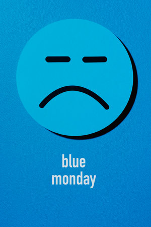a sad face and the text blue monday on a blue backgroundの写真素材