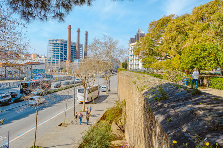 Barcelona, Spain - March 17, 2024: A view of the walls of Les Drassanes Bastion, next to Parallel Avenue in Barcelona, Catalonia, Spain, on a sunny dayのeditorial素材