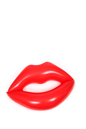 a red mouth-shaped floaty on a white background with some space on topの写真素材