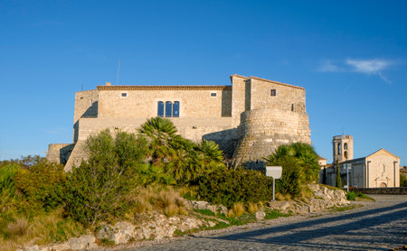 a view of Sant Marti Sarroca Castle, in Sant Marti Sarroca, Catalonia, Spain and the Romanesque church of Santa Maria on the rightの写真素材