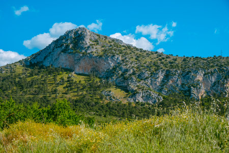 a view of the Sierra del Camorro mountain, part of the Subbaetic range within the Baetic Systems, in Cuevas de San Marcos, Malaga province, southern Spain, on a sunny spring dayの写真素材
