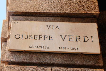 a marble street sign in Milan, Italy, marks Via Giuseppe Verdi, dedicated to the famous composer and musician who lived from 1813 to 1901 and shaped Italian operaの写真素材