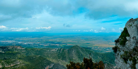 looking out from the cliffs of Serra del Montsia across the vast plains of South Catalonia, Spain,...