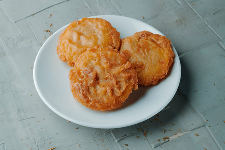 traditional Spanish tortas de camaron, crispy shrimp fritters made with chickpea flour batter and...