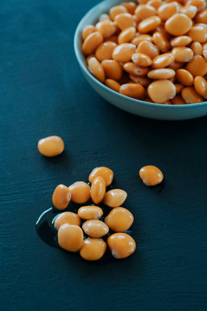 a ceramic bowl filled with spanish altramuces, also known as lupinus albus beans, pickled in brine and ready to be served as a traditional snackの写真素材