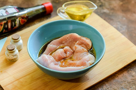 For convenience, transfer the meat and juice to a deep bowl. Add soy sauce immediately.