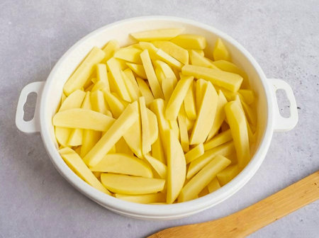 Cut the potatoes into cubes as you would for fries. Then rinse the sticks in ice water 2-3 times to...