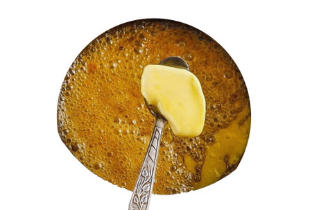 When the caramel turns a nice brown color. Place the butter in a container and stir immediately....