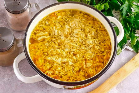 Then break the instant noodles in your hands and add them to the container. Boil for another 5...