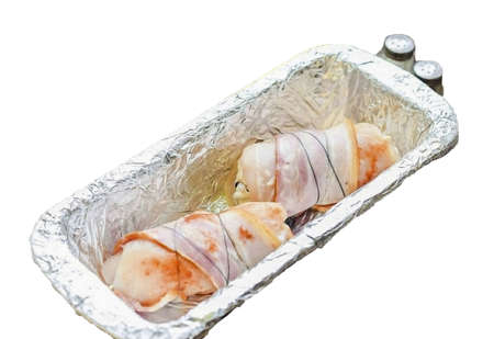 If desired, tie the fillet with a string. Bake fillets in bacon for 40 minutes.の写真素材