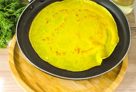 Heat a frying pan on the stove, grease it for the first time with vegetable oil and pour in some of...