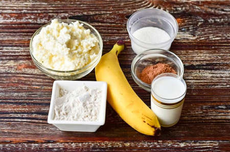 Prepare all ingredients Oatmeal flour banana cottage cheese milk cocoa sugar.の写真素材