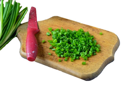 Finely chop the green onion into rings.