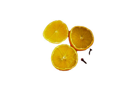 Scald the lemon with boiling water, cut a quarter of the fruit into circles and put in a saucepan. Add the rest of the spices. You can supplement them with cardamom, bay leaves, vanilla sugar.の写真素材