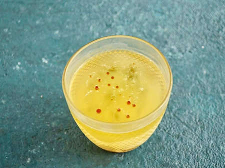 Draw liquid into a syringe and start dripping into cold oil. The size of the eggs can be adjusted.の写真素材