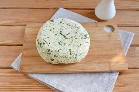 After five hours, remove the gauze. The cheese is ready! Cut into slices and help yourself!の写真素材