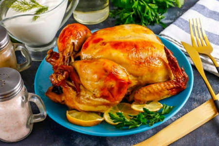Remove the dish from the oven, the chicken from the sleeve and place on a plate. Appetizing baked chicken beckons with its golden side! And if it is also filled with fragrant prunes - hardly anyone can refuse such a delicacy! Serve hot!の写真素材