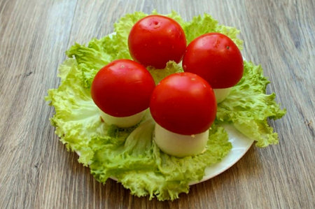 Place the caps on top of the stuffed eggs.