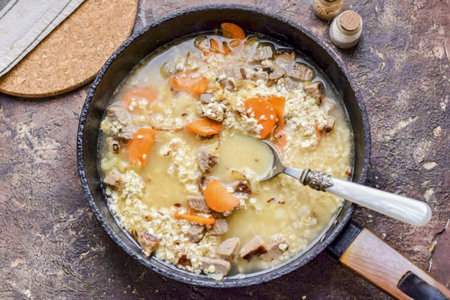 Pour boiling water over everything, stir and cook covered for 12-15 minutes.の写真素材