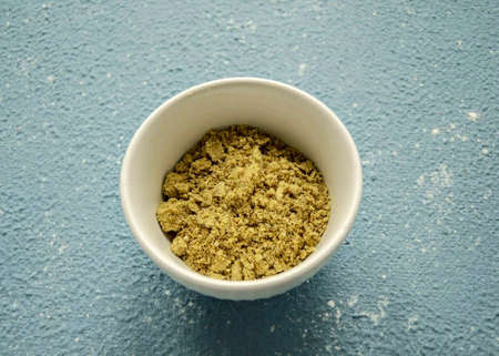 Grind the flax seeds in a coffee grinder.の写真素材