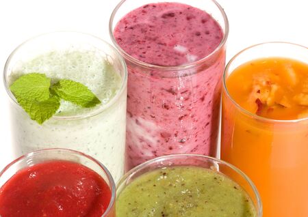 Fresh fruits cocktails on white backgroundの写真素材