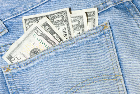 Denim jeans with money in the pocket