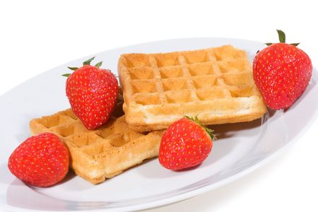 Waffles with strawberries on white backgroundの写真素材